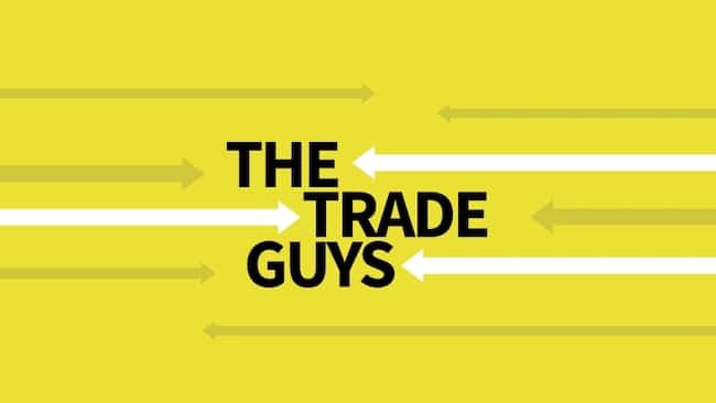 An image of the Trade Guys podcast logo: the name of the podcast surrounded by white arrows.